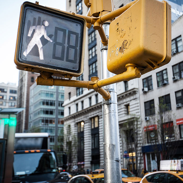 two children cross sidewalk